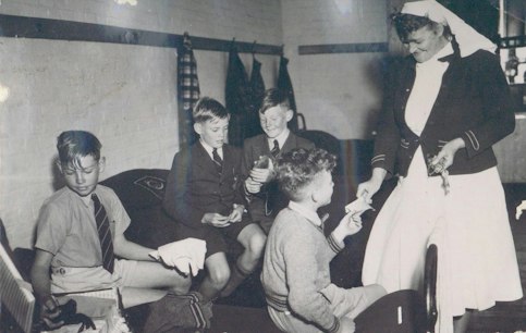 1950s-students-nurse-mud.jpg
