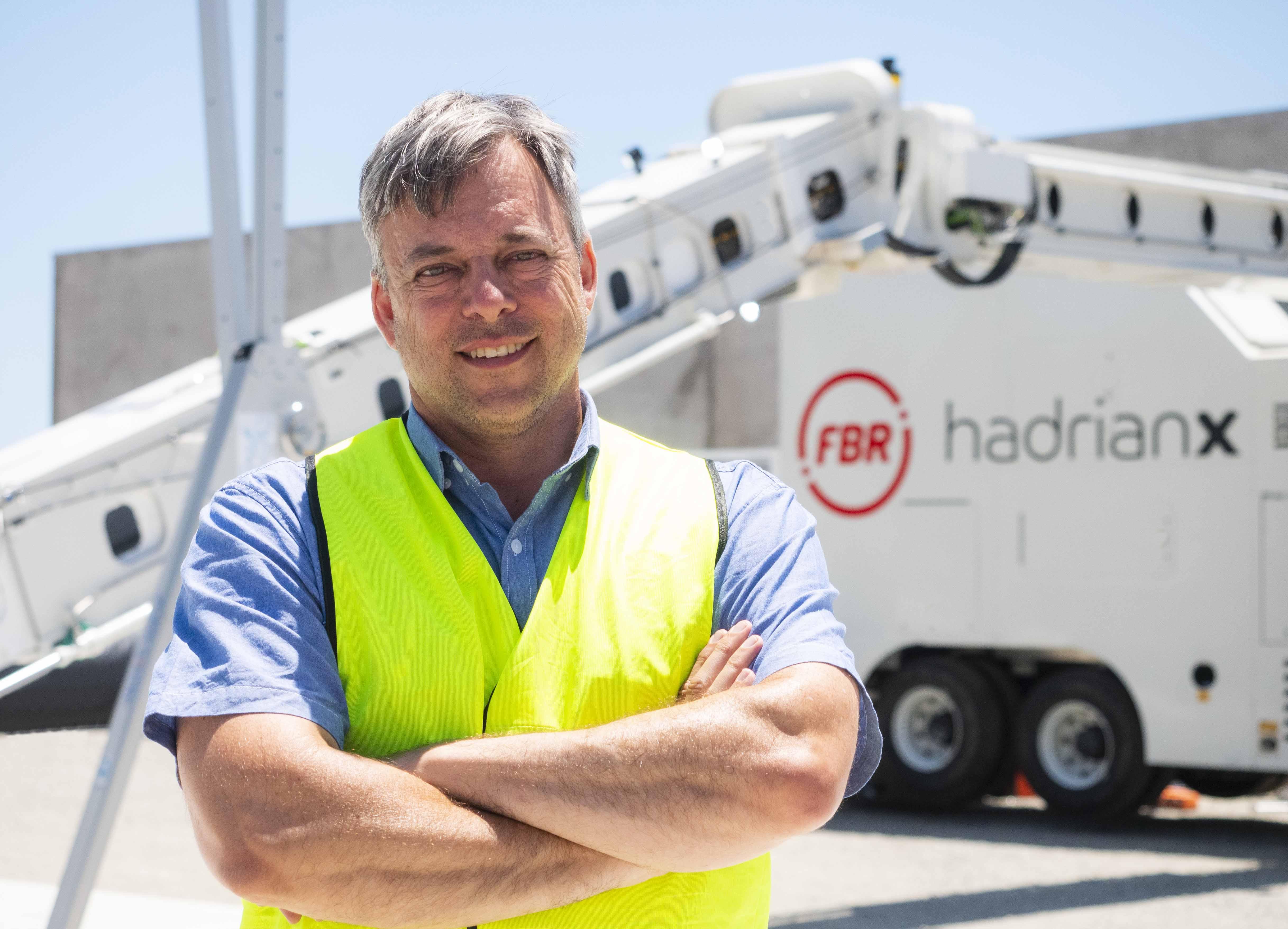 Mark Pivac, Chief Technical Officer, FBR Ltd standing in front of the Hadrian X